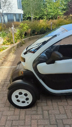 Looping walkaround of the Twizy: nearside, the back, both wheel pods and
              into the cabin